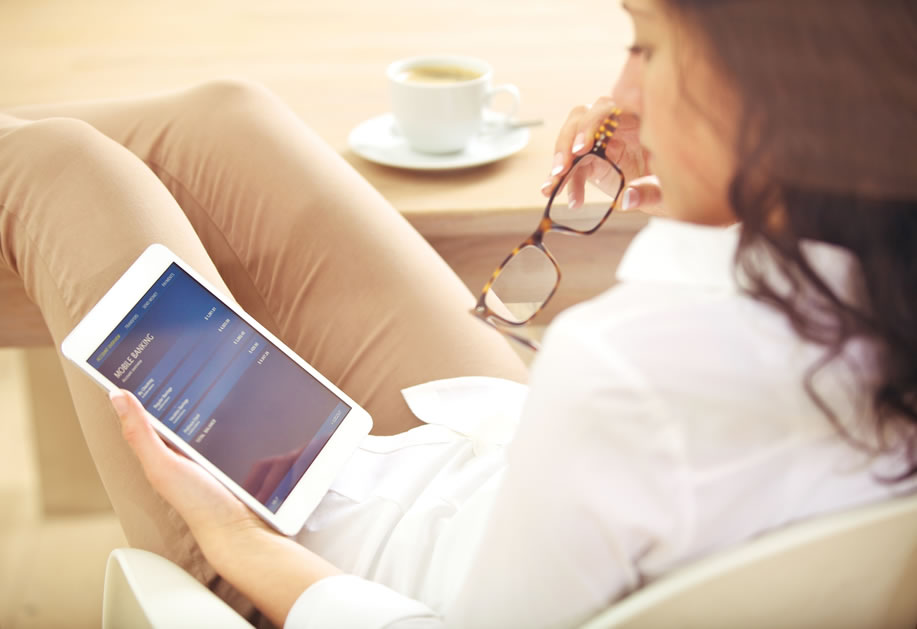 Woman checks her online banking statement
